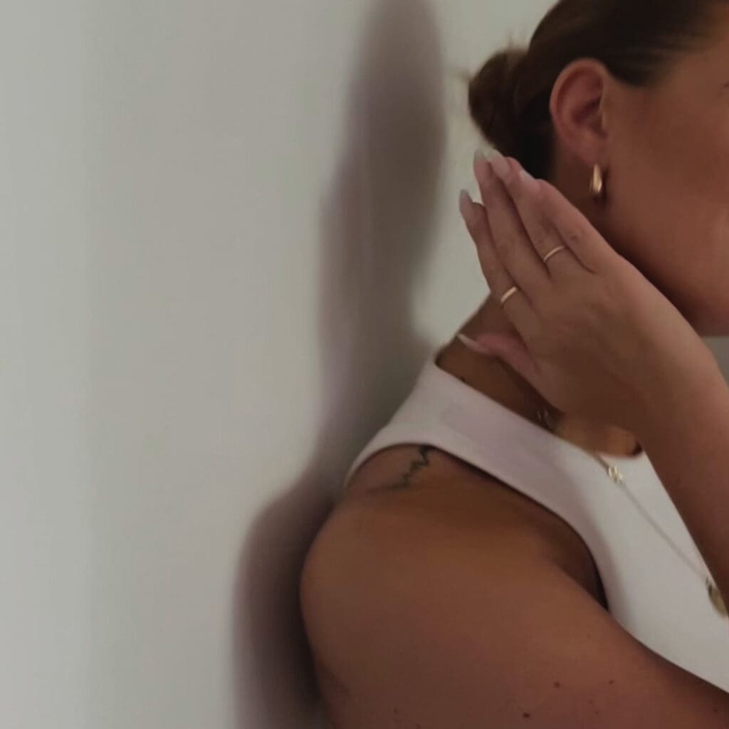Woman in quiet reflection, symbolizing emotional healing and inner calm after trauma therapy